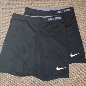 Two pairs of NIKE compression shorts